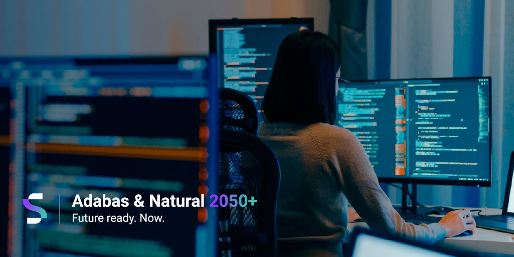 woman coding in a dark room